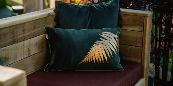 Our bespoke cushion covers featuring gold leafs and emerald green palette for ultimate style