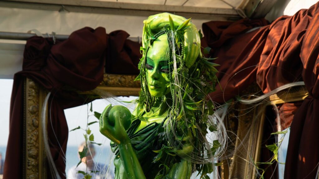 A green goddess prop made from foliage