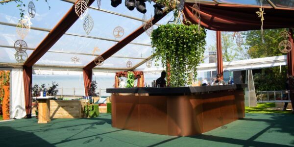 Our stunning central copper bar with overhanging vibrant foliage chandelier focal point flooded in natural lighting