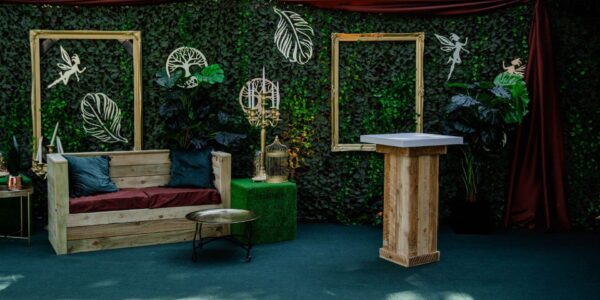 Leafy lounge setup in an enchanted garden.