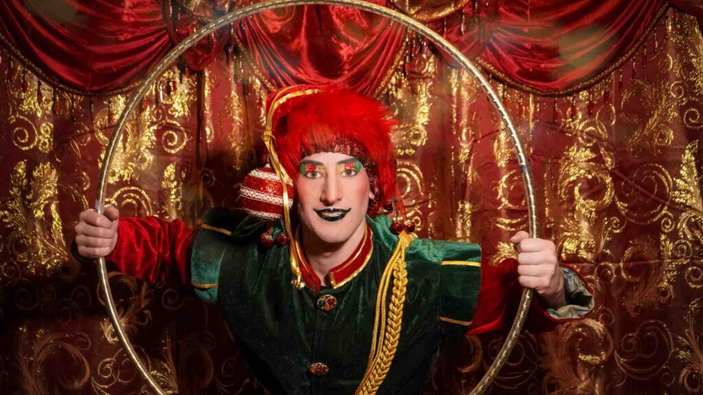 Bring holiday joy with a Christmas elf acrobat performer