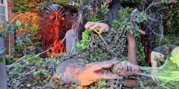 Jungle themed zombie Halloween Decorations including crocodile eating a real zombie! Hire your event decoration with us.