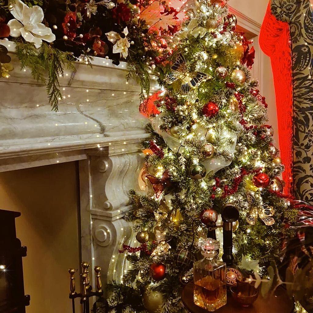 Beautiful and unique christmas tree designs and mantel piece with whiskey for Christmas event theming.