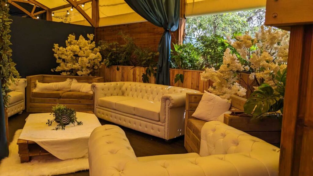 A summer festival seating area in a marquee.