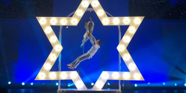 Elevate your event with a mesmerising LED star performance by a hoop aerialist!