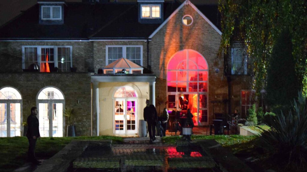 Back of Halloween Mansion party complete with red projection lighting.