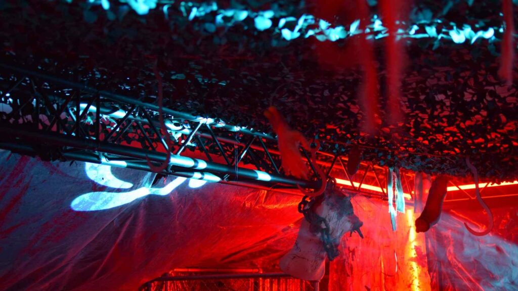Close-up of lighting and rigging set-up used in 'slaughterhouse' room of Halloween mansion party.