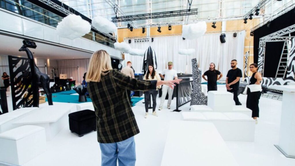 Event production team being led and split into different areas of the event space.