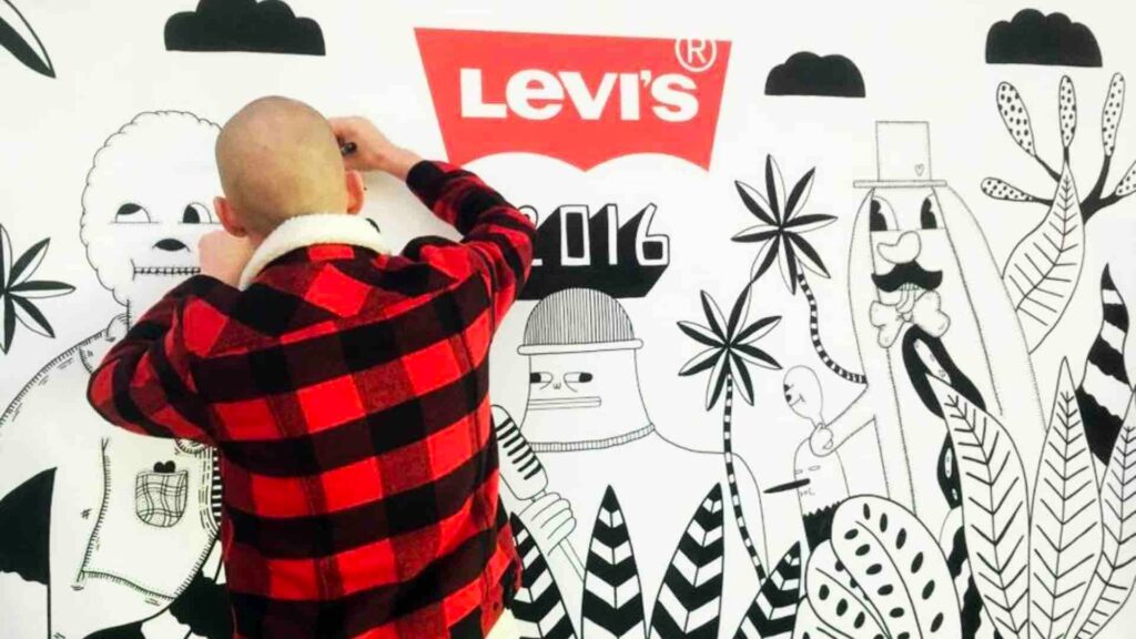 Live mural artists used for exhibition stands painting for Levi.