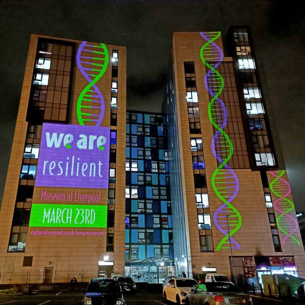 Projected campaign of "We Are" on a building.