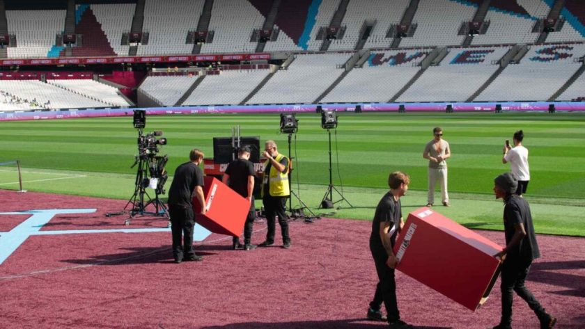 Team rehearsing set up of Sidemen 2023 Charity Match awards stage.
