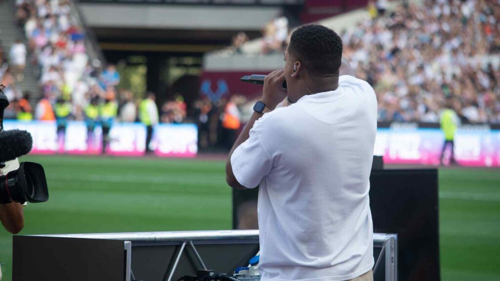 DJ Win supporting Aitch halftime performance.