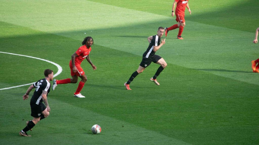 Ethan (Behzinga) on the ball, pushing forward in the lead up to the first goal of the match.