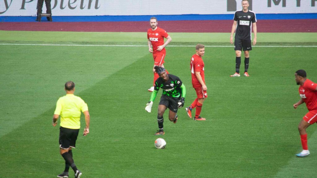 KSI dribbling past YouTube Allstars team in the second half.