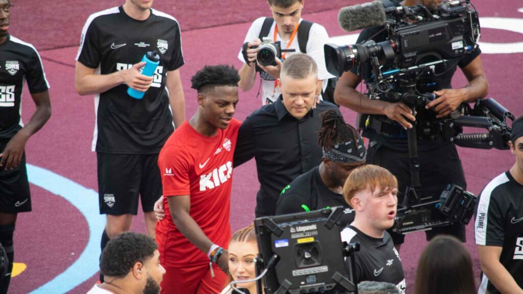 Speed and Mark Goldbridge talking as they exit the pitch after the first half.