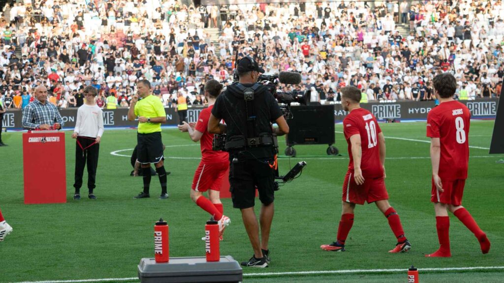 YouTube Allstars entering the pitch to receive medals.