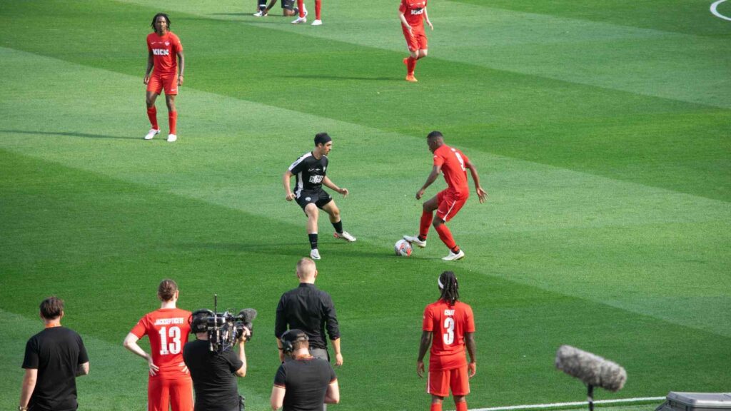 Yung Filly on the ball, trying to pass Tareq.