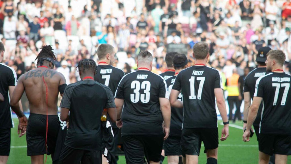 Sidemen celebrating charity match win.