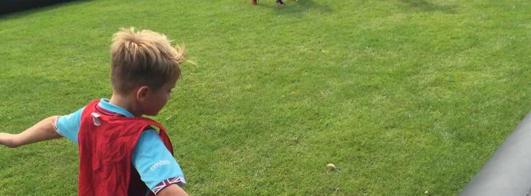 Children-Playing-On-Inflatable-Football-Pitch Children-Playing-On-Inflatable-Football-Pitch