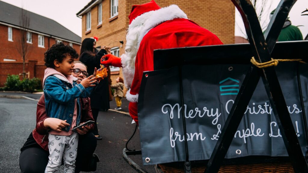 A christmas sleigh with messaging 'Merry Christmas' at a Simple Life Event.