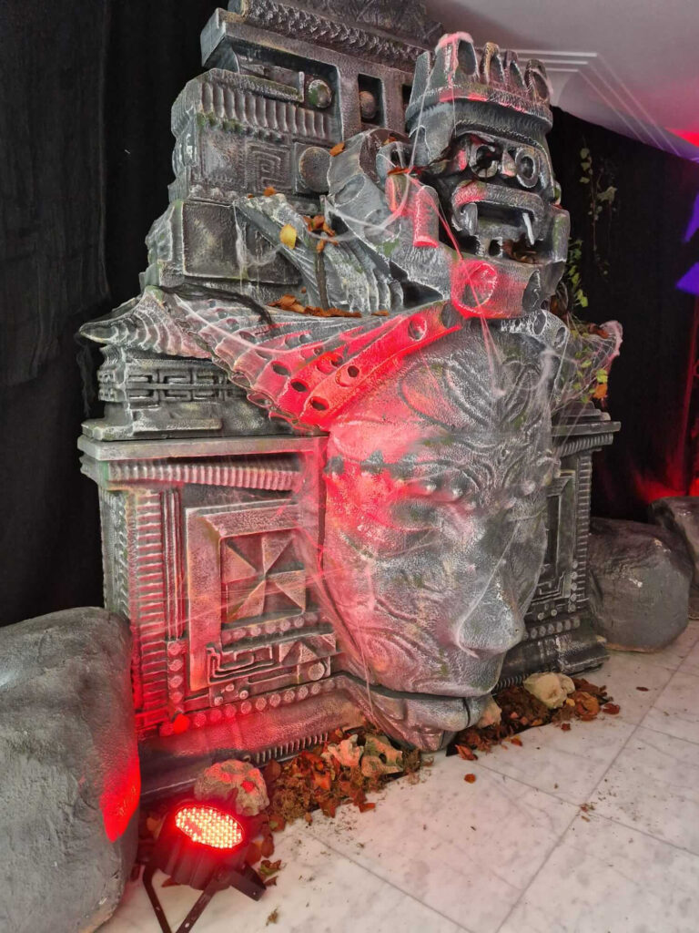A bespoke sculpture made to look like stone worship temple for cult horror event.