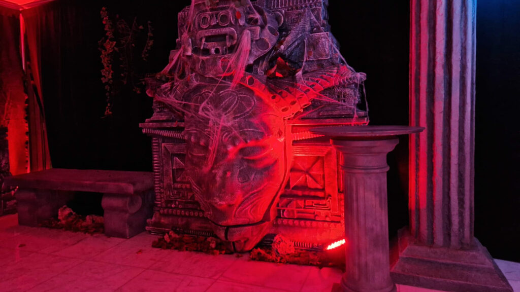 An illuminated stone prop used for a cult horror theme.