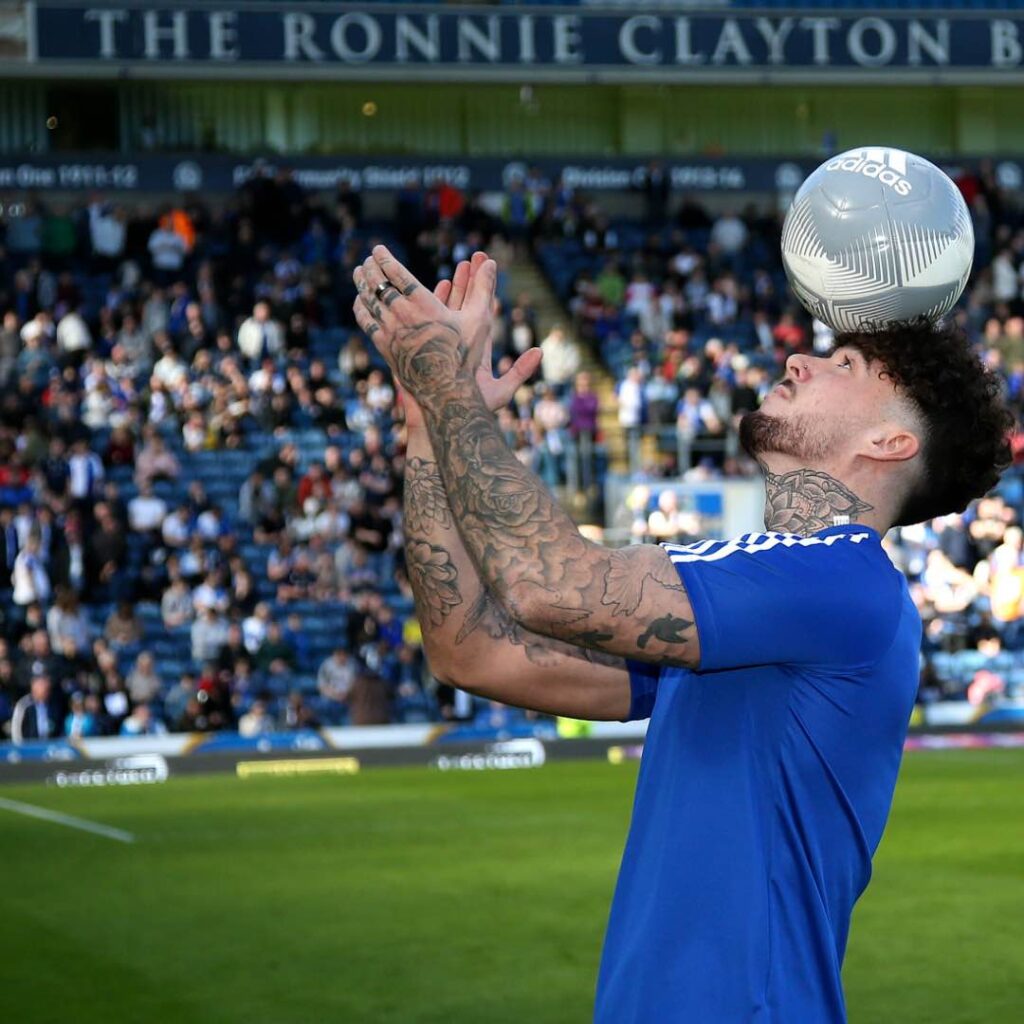 Hire a football freestyler for your fan zone to perform head balance act.