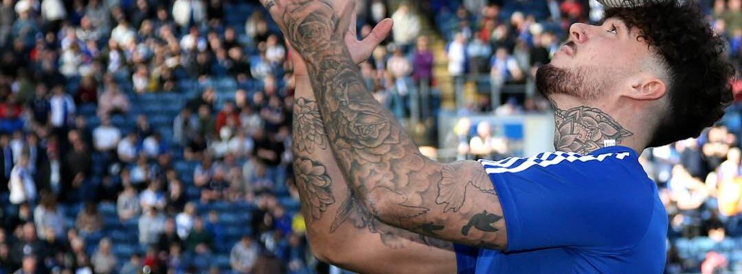 Football-Freestyler-Balancing-Football-On-His-Head Football-Freestyler-Balancing-Football-On-His-Head