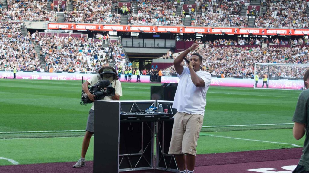 DJ Win, Aitch's DJ getting the crowd going during halftime performance.