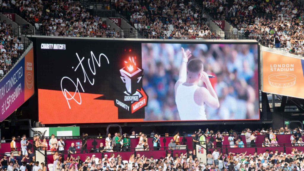 Aitch getting the audience involved in the Sidemen Charity Match 2023 halftime performance.