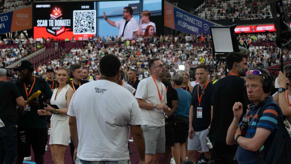 Michael Charles, Creative Director of Julia Charles Event Management, pitch side at the Sidemen Charity Match 2023.