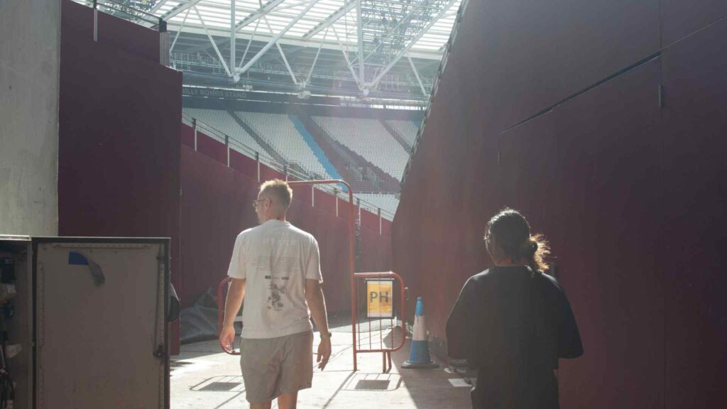 Creative Director, Michael Charles and Joanne, event manager at Julia Charles Event Manager entering the London Stadium.