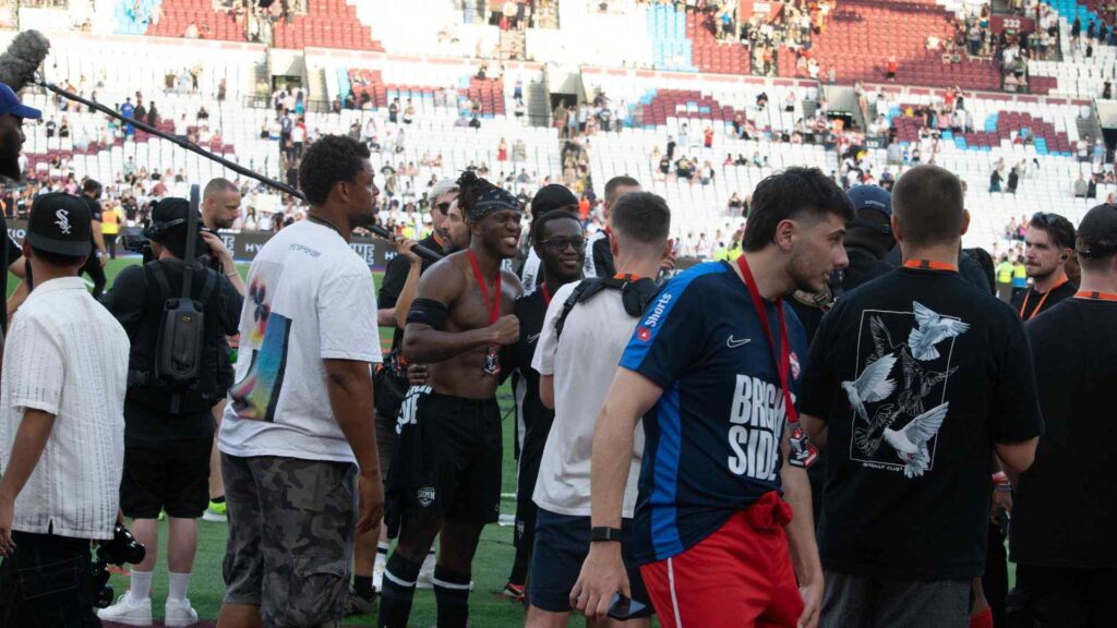 KSI and brother Deji getting a photo together after charity match win.