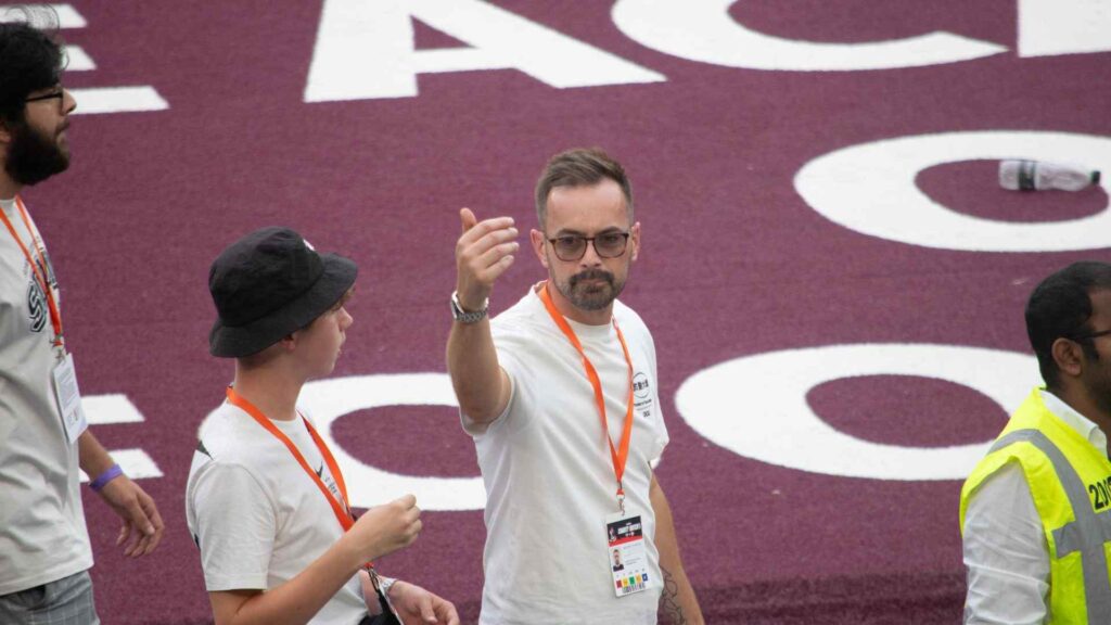 Michael Charles, Creative Director of Julia Charles Event Management pitch side.
