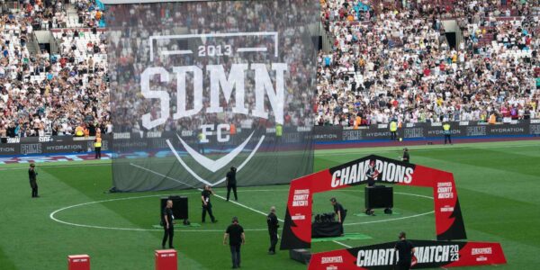 Sidemen-Charity-Match-2023-Setting-Up-Champions-Facade-And-Floating-Banner
