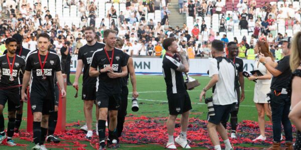 Sidemen-Charity-Match-2023-Sidemen-FC-Celebrating-On-Pitch-After-Win