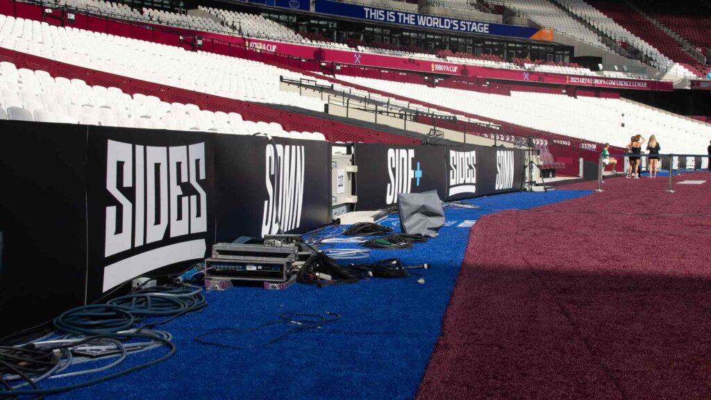Sidemen Charity Match 2023 'Sides' branded banners around pitch.