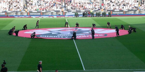 Sidemen-Charity-Match-2023-Team-Setting-Up-Centre-Circle-For-Aitch-Half-Time-Performance