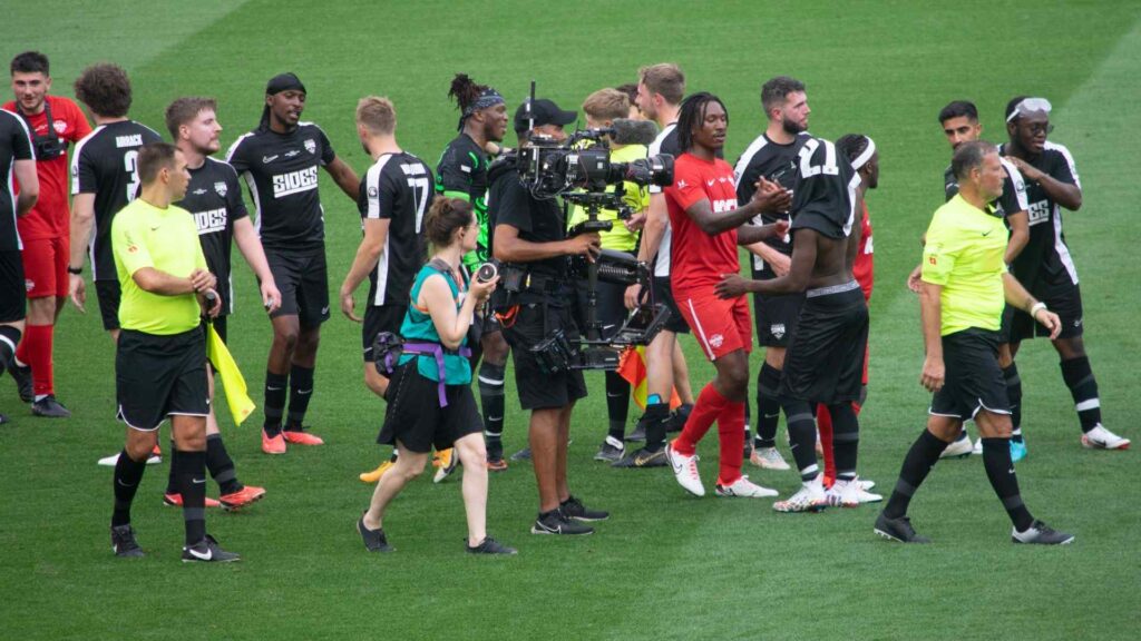 Players shaking hands after the final whistle.