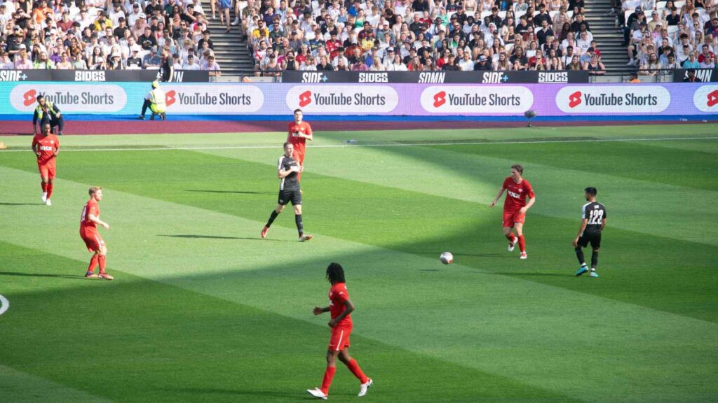 Max Fosh passing the ball to Chris MD.