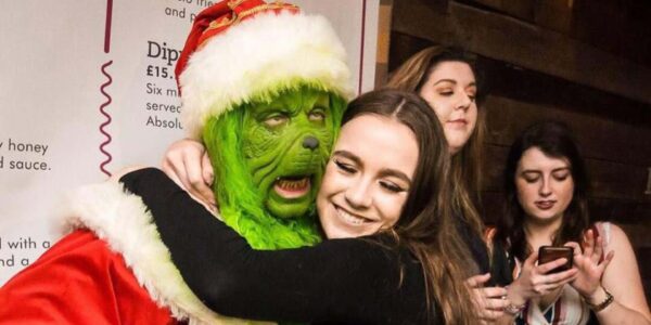 Authentic-Grinch-Peformer-Hugging-Guest