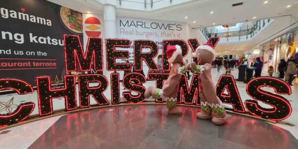 Ginger-Bread-Characters-Dancing-With-Christmas-Sign