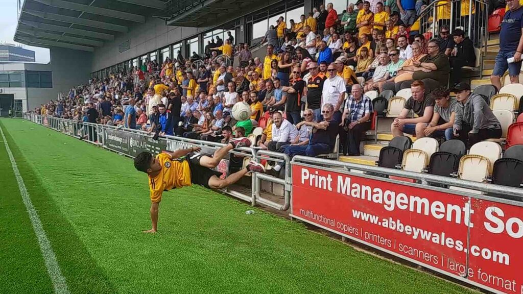 Football freestyler dazzling guests a stadium event with football trick skills.