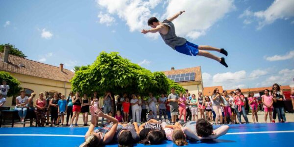 Acrobat-For-Hire-Flying-Over-Crowd