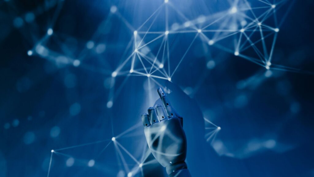 Illustration of artificial intelligence - robot hand interacting with digital display.