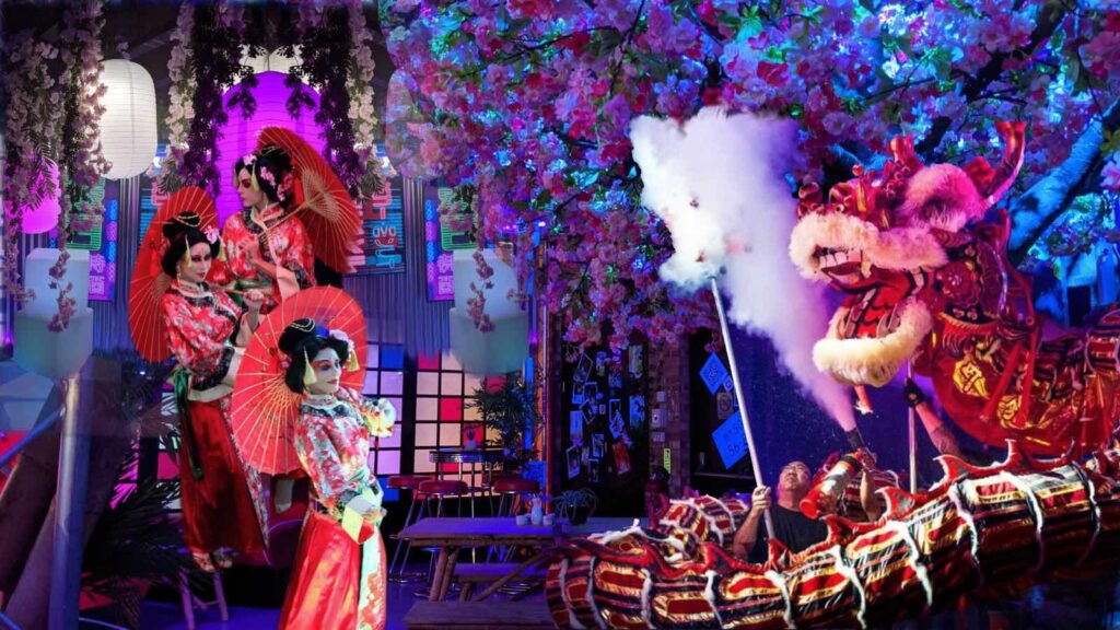Chinese New Year themed events including props and decor as well as dragon dancers.