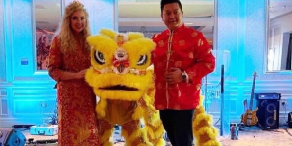 Guests-With-Yellow-Lion-Dancer-At-Event