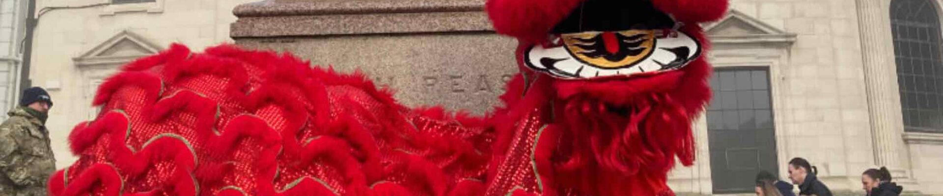 Large-Red-Lion-Dancer-At-Monument Large-Red-Lion-Dancer-At-Monument