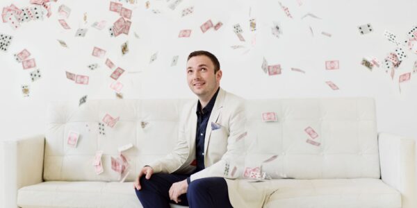 Magician-Looking-At-Cards-In-The-Air