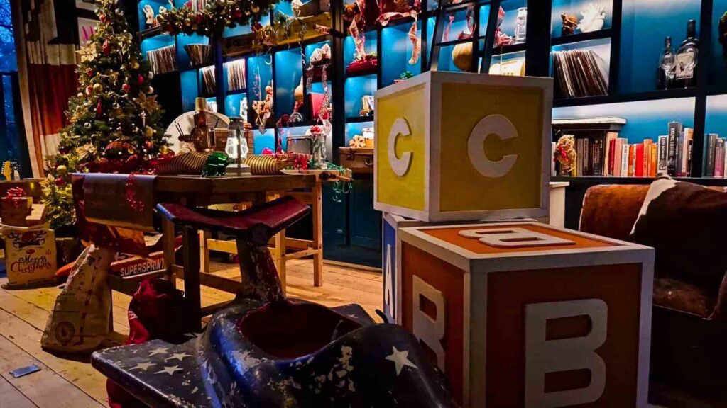 Christmas video set design featuring a Santas Toyshop designed by Julia Charles for a Riot Squad music video.